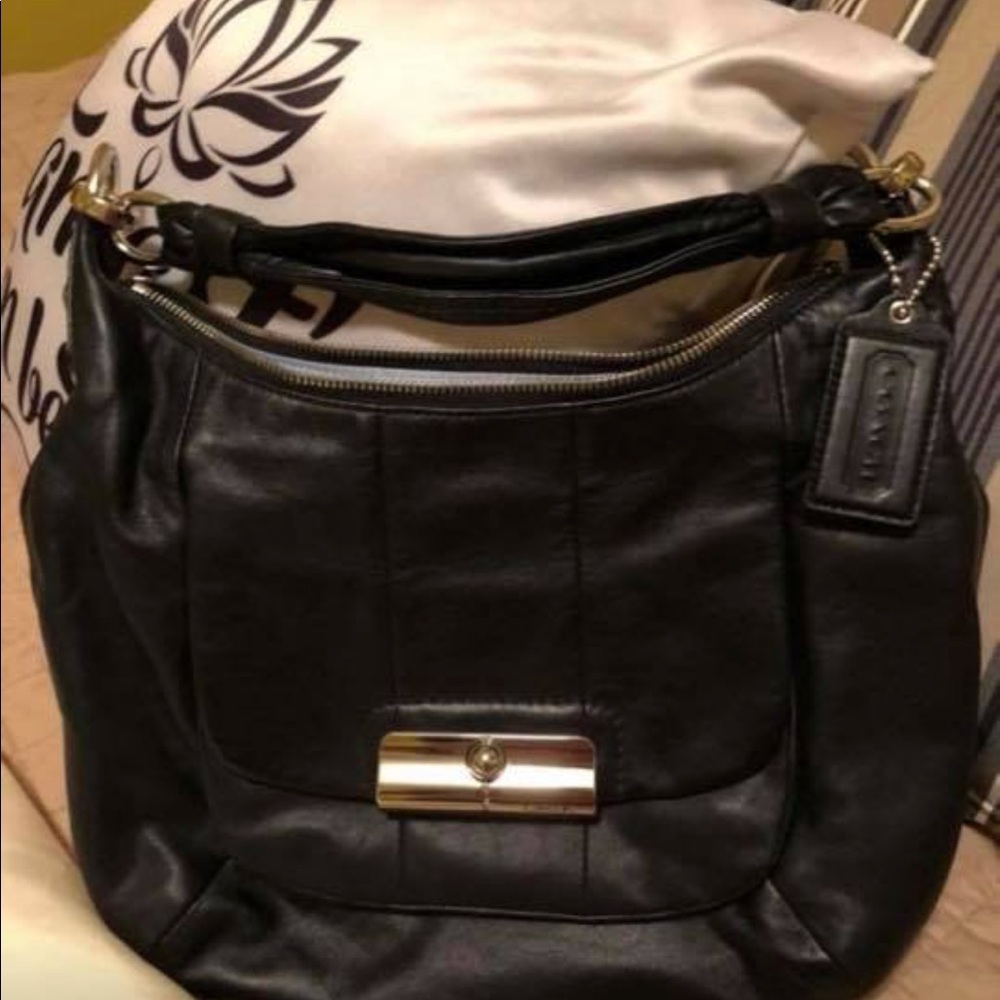 Black leather coach purse, used once.